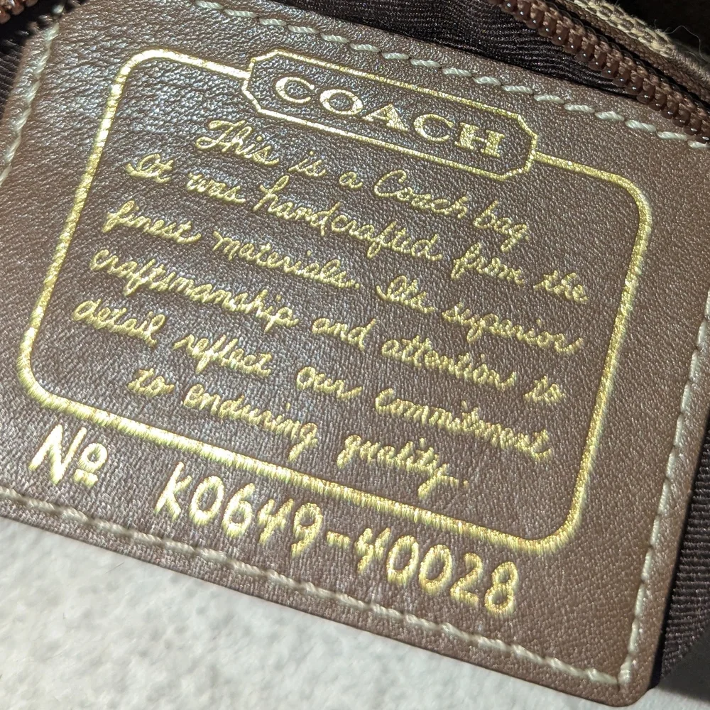 Coach Brown and Tan Signature Wristlet. 40028